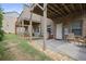 Backyard stone patio with green grass, brick construction and privacy fence at 1582 Cambridge Pl, Marietta, GA 30062