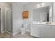 Well-lit bathroom featuring a glass-enclosed shower and a white vanity with ample storage at 1582 Cambridge Pl, Marietta, GA 30062