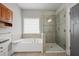 This bathroom includes both a glass enclosed shower and a soaking tub at 1582 Cambridge Pl, Marietta, GA 30062