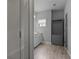 Bright bathroom boasting tiled floors, a glass shower, and a gray cabinet with storage at 1582 Cambridge Pl, Marietta, GA 30062