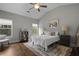 Spacious bedroom featuring hardwood floors, vaulted ceiling, and two windows for ample natural light at 1582 Cambridge Pl, Marietta, GA 30062
