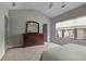 This bedroom offers neutral carpet and color scheme, and a full size dresser at 1582 Cambridge Pl, Marietta, GA 30062