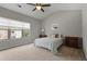 Comfortable bedroom featuring neutral carpet, vaulted ceiling, and large window for plenty of natural light at 1582 Cambridge Pl, Marietta, GA 30062