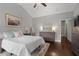 Cozy bedroom with a soft rug, featuring a full bed, dresser and art, under a vaulted ceiling at 1582 Cambridge Pl, Marietta, GA 30062