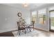 Cozy dining area features a table with seating for two and lots of natural light at 1582 Cambridge Pl, Marietta, GA 30062