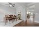 Bright dining room with hardwood floors, ceiling fan, and views to the living spaces at 1582 Cambridge Pl, Marietta, GA 30062