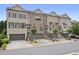 Charming townhome row featuring brick facade, two-car garages, and meticulously kept front yards at 1582 Cambridge Pl, Marietta, GA 30062