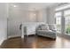 Comfortable upstairs hall featuring hardwood flooring, seating, and balcony access at 1582 Cambridge Pl, Marietta, GA 30062