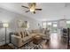 Inviting living room with comfortable seating, ceiling fan, and bright lighting at 1582 Cambridge Pl, Marietta, GA 30062