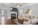 Cozy living room with fireplace, tv, neutral paint, and decorative art at 1582 Cambridge Pl, Marietta, GA 30062