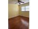Bedroom with hardwood floors, yellow walls, and natural light at 801 Needle Rock Dr, Stone Mountain, GA 30083