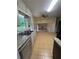 Traditional kitchen features granite countertops, double sink, tile flooring, and views to the living room at 801 Needle Rock Dr, Stone Mountain, GA 30083