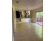 Living room with tile floors, and a sliding glass door that opens to the outdoor patio at 801 Needle Rock Dr, Stone Mountain, GA 30083