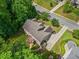 An aerial view of the home highlighting the roof, driveway, landscaping and surrounding neighborhood at 111 Millstone Way, Canton, GA 30115