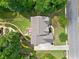 Aerial shot of the home showcasing the roof, driveway, landscaping and the surrounding greenery at 111 Millstone Way, Canton, GA 30115