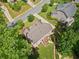 Aerial shot showcases the home's roof, surrounding greenery, and the inviting wooden deck at 111 Millstone Way, Canton, GA 30115