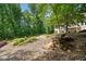 Beautiful backyard featuring a garden bed, chairs, and deck, perfect for relaxation and outdoor enjoyment at 111 Millstone Way, Canton, GA 30115