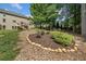Inviting backyard with lush landscaping, a raised garden bed, and an elevated wood deck at 111 Millstone Way, Canton, GA 30115