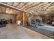 Spacious basement featuring exposed ceiling, concrete floor, and ample room for various activities and storage at 111 Millstone Way, Canton, GA 30115