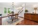 Dining room boasts hardwood floors, natural light from the windows and flows into the staircase and hall at 111 Millstone Way, Canton, GA 30115