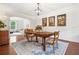 Elegant dining room with hardwood floors, stylish decor, and plenty of natural light at 111 Millstone Way, Canton, GA 30115