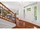 Bright entryway with hardwood floors and staircase featuring natural light through the large windows at 111 Millstone Way, Canton, GA 30115