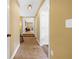 A hallway with carpet and painted walls, features multiple doors, leading to various rooms, and creating an open flow at 111 Millstone Way, Canton, GA 30115