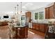 Bright, updated kitchen with granite countertops, stainless steel appliances, and hardwood floors at 111 Millstone Way, Canton, GA 30115