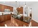 Spacious kitchen featuring dark wood cabinets, granite countertops, and stainless steel appliances at 111 Millstone Way, Canton, GA 30115