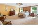 Spacious main bedroom with a seating area, dresser, and natural light, creating a relaxing and inviting atmosphere at 111 Millstone Way, Canton, GA 30115