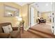 Cozy sitting room with a chair, love seat, and a view of a hallway that leads into a seating area at 111 Millstone Way, Canton, GA 30115