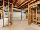 Unfinished basement with exposed beams and a concrete floor at 1110 Upper Hembree Rd, Roswell, GA 30076