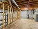 Spacious unfinished basement featuring exposed ceiling and concrete floors; ready for customization at 1110 Upper Hembree Rd, Roswell, GA 30076