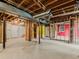 Unfinished basement with exposed duct work and concrete floor at 1110 Upper Hembree Rd, Roswell, GA 30076