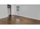 Bedroom featuring hardwood floors, neutral paint and a sliding closet at 1110 Upper Hembree Rd, Roswell, GA 30076