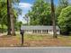 Welcoming home exterior with green trees surrounding the property at 1110 Upper Hembree Rd, Roswell, GA 30076