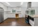 Updated kitchen with white cabinets, granite countertops, and stainless steel appliances at 1110 Upper Hembree Rd, Roswell, GA 30076
