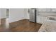 Updated kitchen with granite countertops and stainless steel appliances, with hardwood floors at 1110 Upper Hembree Rd, Roswell, GA 30076