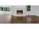 Inviting living room with a brick fireplace and large windows offering scenic views at 1110 Upper Hembree Rd, Roswell, GA 30076