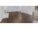 Bright living room with hardwood floors and a white brick fireplace at 1110 Upper Hembree Rd, Roswell, GA 30076