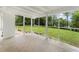Bright sunroom with large windows offering scenic backyard views and natural light; perfect for relaxation at 1110 Upper Hembree Rd, Roswell, GA 30076