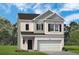 Charming two-story home featuring a brick facade, attached two-car garage, and well-maintained landscaping at 1205 Elowen Dr, Austell, GA 30168