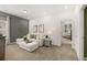 Comfortable living room with a sectional sofa, neutral decor, and access to other rooms at 1205 Elowen Dr, Austell, GA 30168