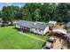 Exterior aerial showcasing the home, large yard, and outbuildings at 140 Wilbanks St, Buford, GA 30518