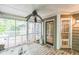 The home has a screened-in back porch with a ceiling fan and wooden floor at 143 Cotton Mill Dr, Hiram, GA 30141