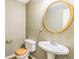 Bathroom features vanity and toilet with wood seat at 143 Cotton Mill Dr, Hiram, GA 30141