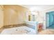 A bathroom featuring a tub and vanity with colorful cabinet doors at 143 Cotton Mill Dr, Hiram, GA 30141