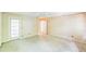 A bedroom with carpet, a ceiling fan, and a door to the outside at 143 Cotton Mill Dr, Hiram, GA 30141