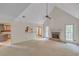 Living room with a fireplace, ceiling fan, and access to other rooms at 143 Cotton Mill Dr, Hiram, GA 30141