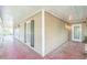 Wide porch showcasing outdoor lighting, a stained floor, and views of the surrounding yard at 143 Cotton Mill Dr, Hiram, GA 30141